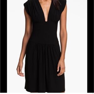 Norma Kamali deep v neck, fit and flare black dress, size medium
